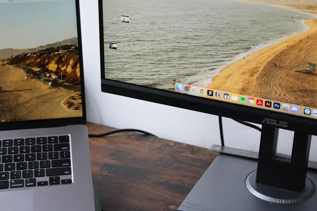 laptop connected to external monitor and docking station on desk