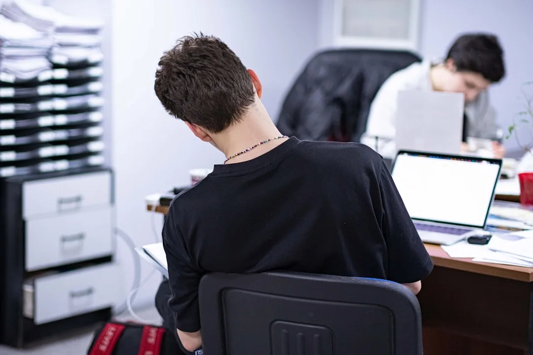 Person carefully examining computer motherboard