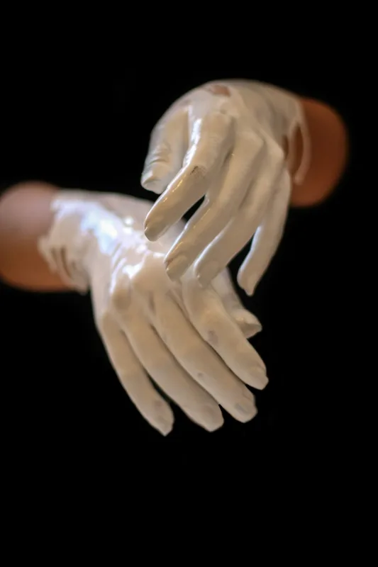 Hands using compressed air on computer components
