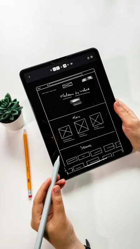 Web designer reviewing content strategy on a tablet