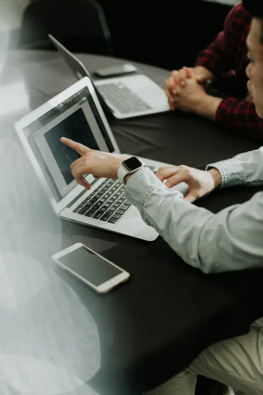Team reviewing a website content plan on a laptop