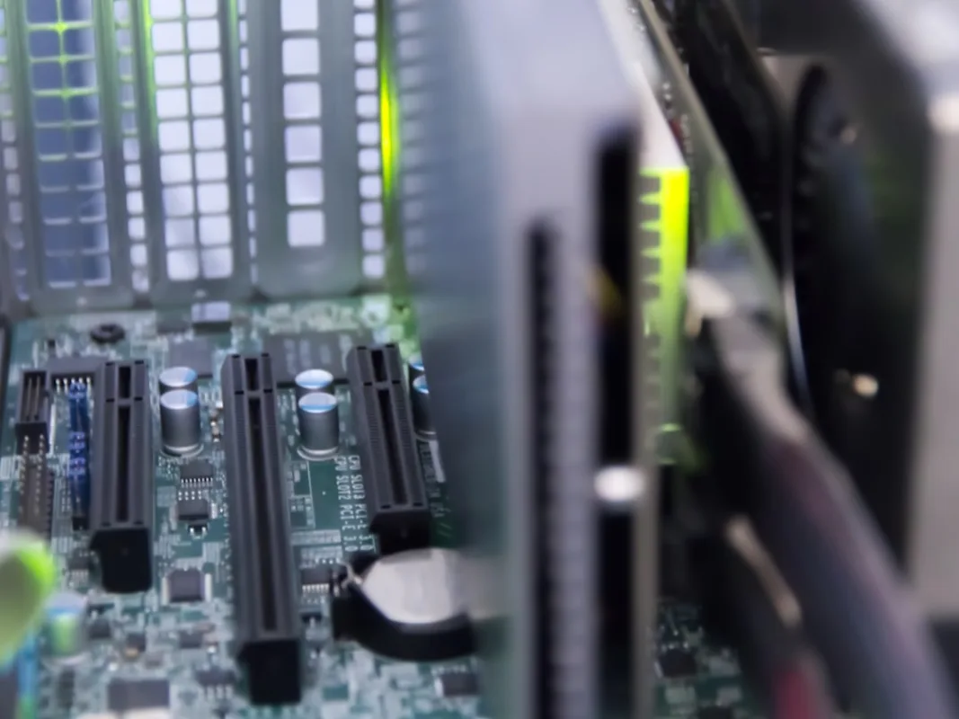 custom PC builder holding RAM sticks over motherboard