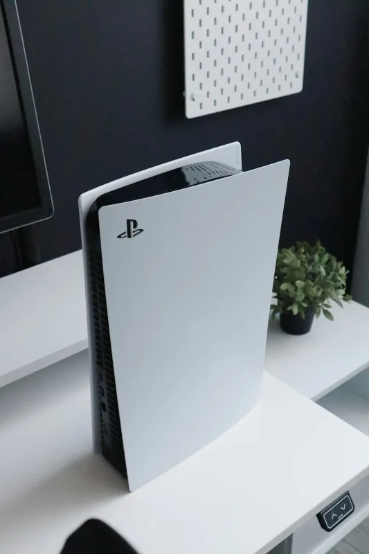 ps5 on desk with blank television