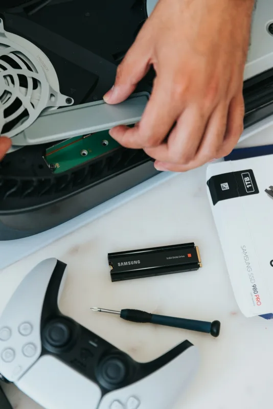 Technician repairing a PS5 console