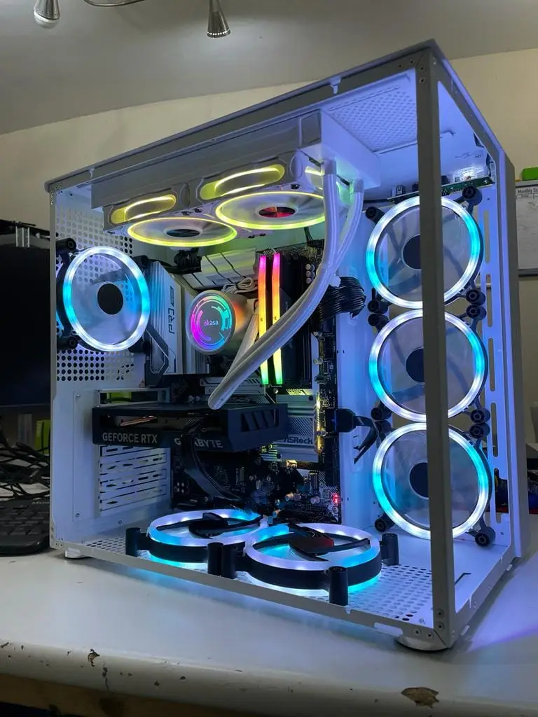 White RGB gaming PC with liquid cooling, triple top fans and vertical airflow layout